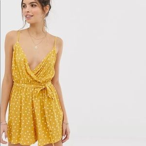 ASOS DESIGN Yellow wrap tie front romper in crinkle in polka dot